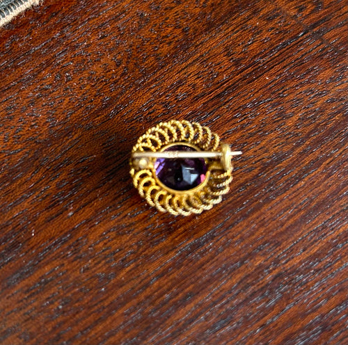 Gold and Amethyst filigree scroll brooch 1890-1915.