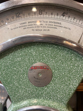 Large speckled green enameled shop scales.